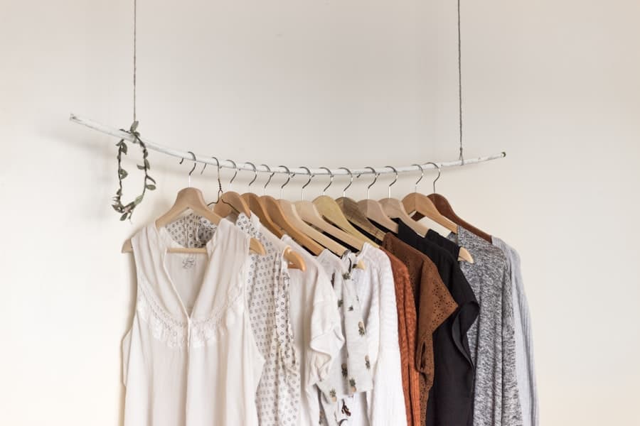 A row of clothes hanging in a shop