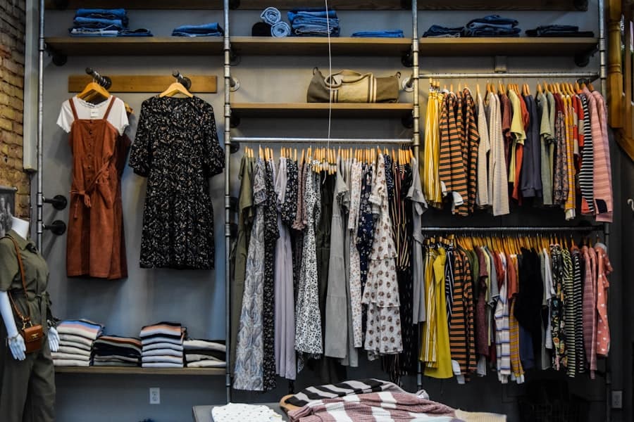 A shop's shelves of folded and hung clothing